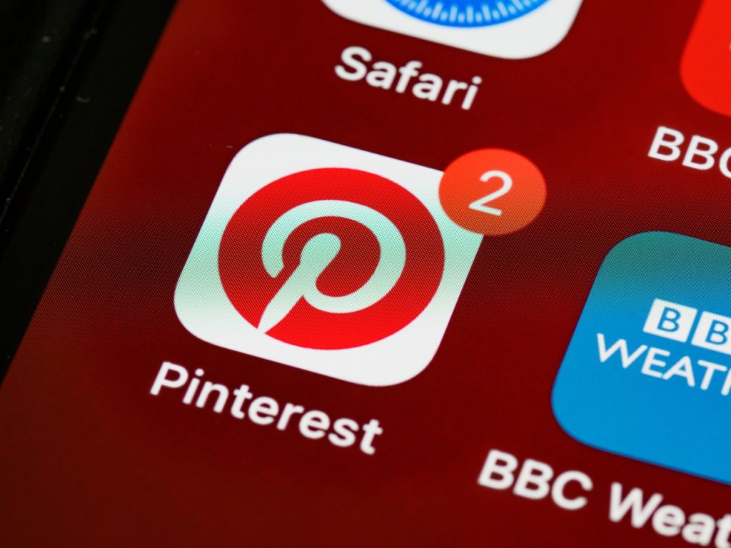 A phone showing Pinterest Icon for demographics 